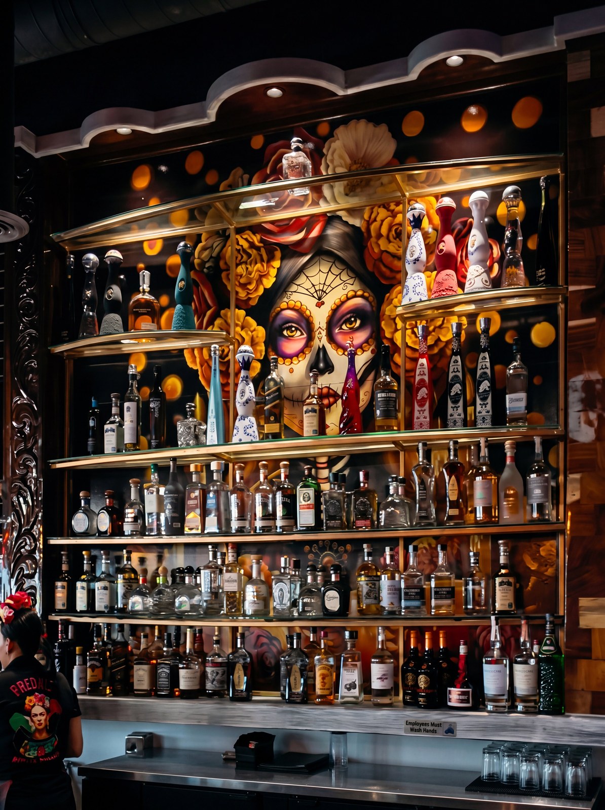 Frida's bar shelf with La Catrina mural